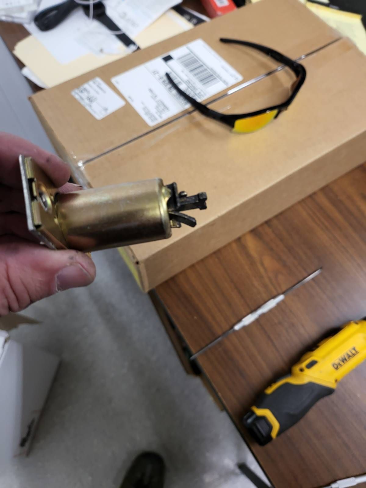 A person is holding a piece of metal in their hand