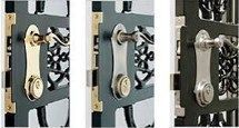 A close up of three different types of locks on a door.