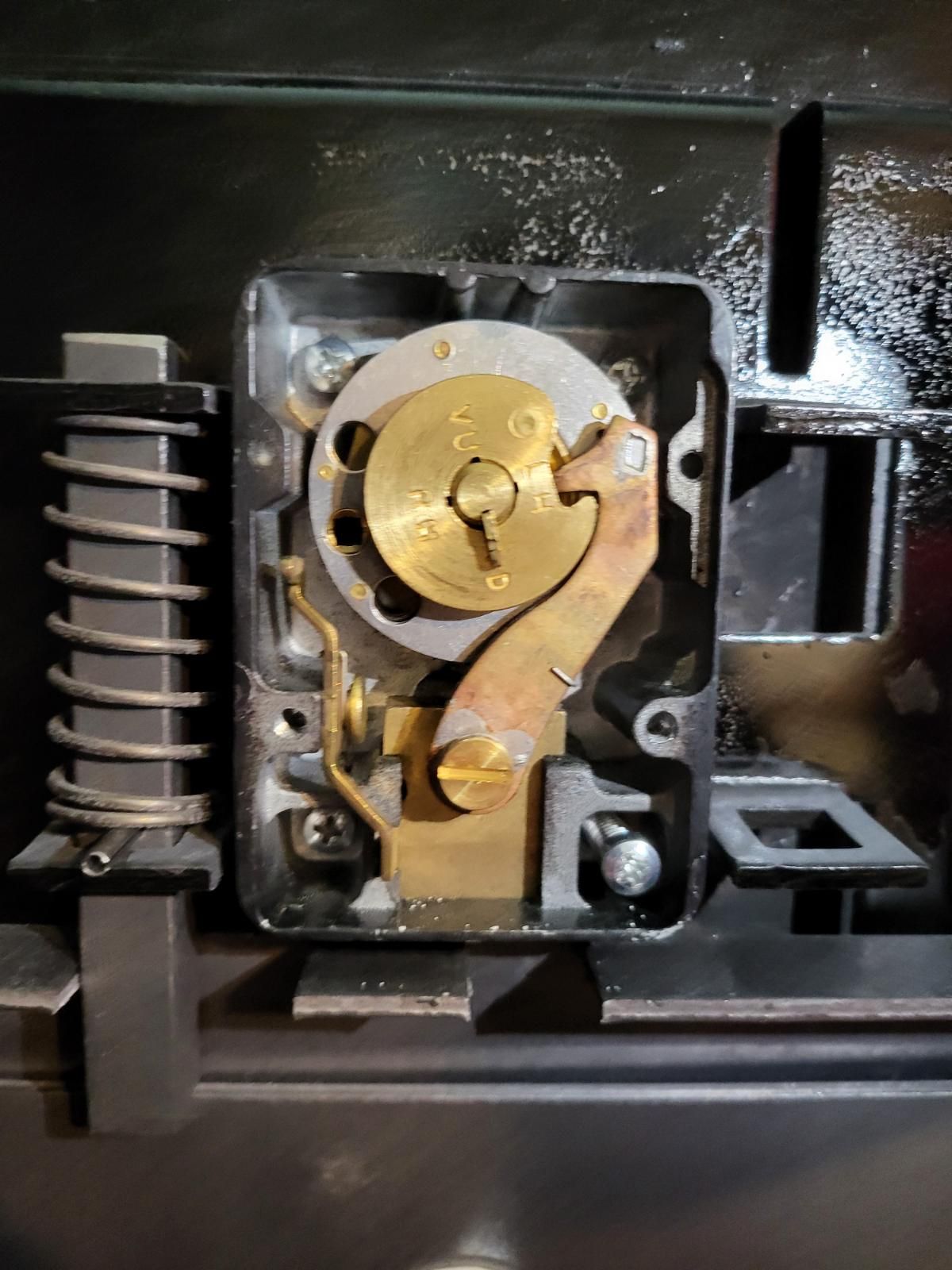 A close up of the inside of a lock on a door.