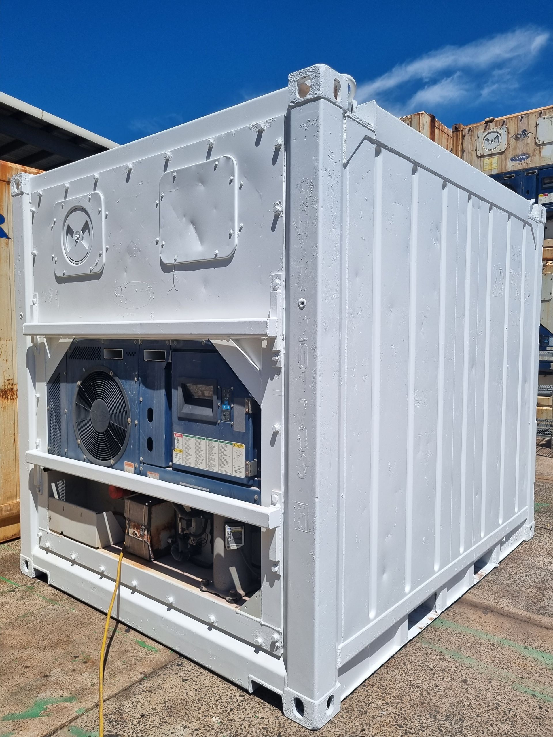 White refrigerated shipping container outdoors with cooling unit visible — TTS Refrigeration in Pinelands, NT