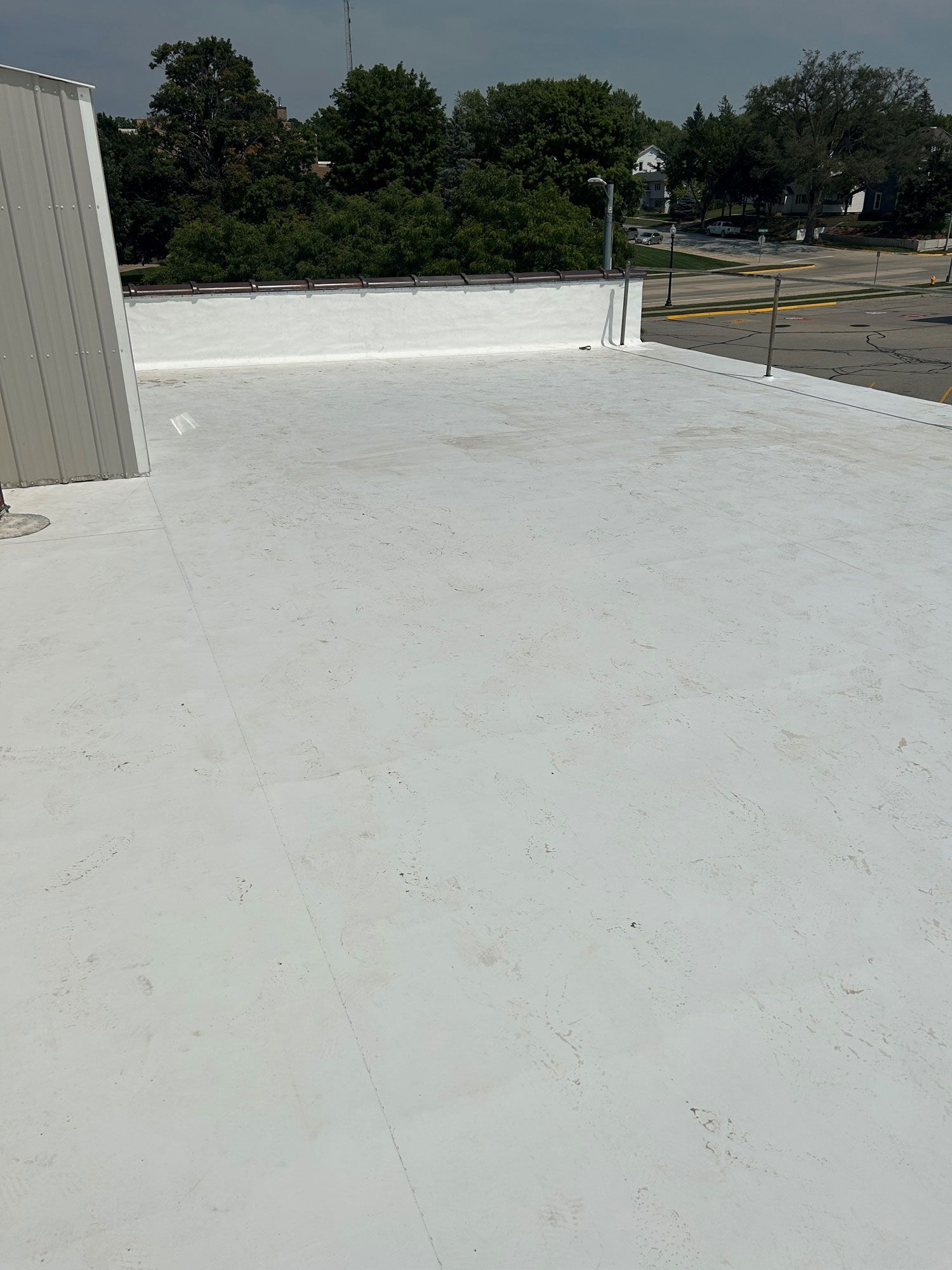 Roof With Trees In The Background — Waverly, IA — Star Line Coatings