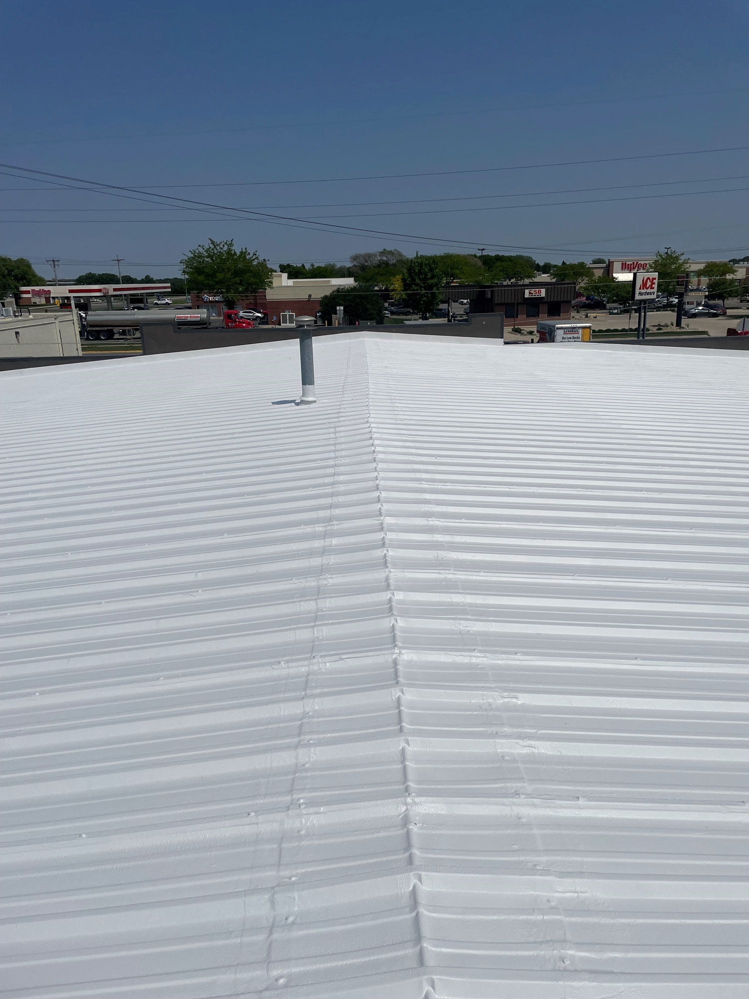 Roof With A Blue Sky In The Background — Waverly, IA — Star Line Coatings