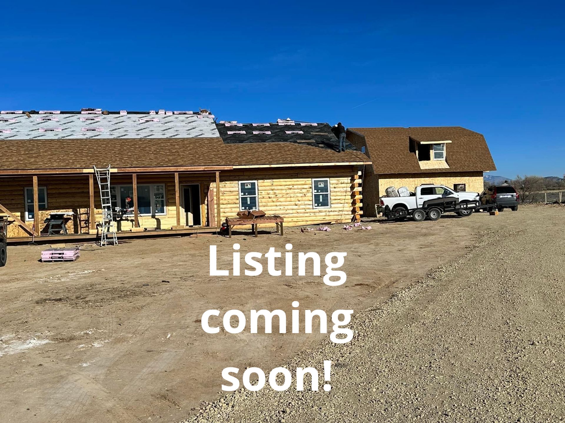 A large log cabin is being built and is for sale