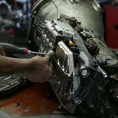 Mechanic Working on Car Transmission — Auto Repair Lexington, KY