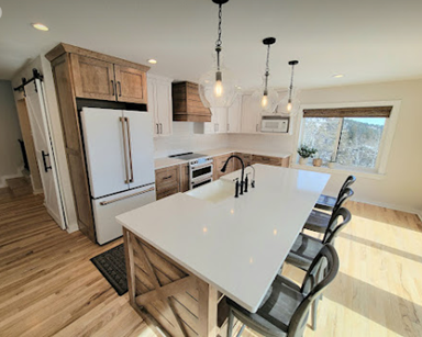 There is a large island in the middle of the kitchen.