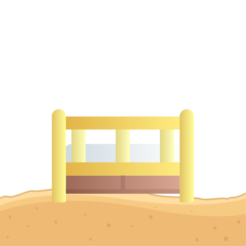 A cartoon-style bed, with yellow railing and brown base, on a sandy surface.