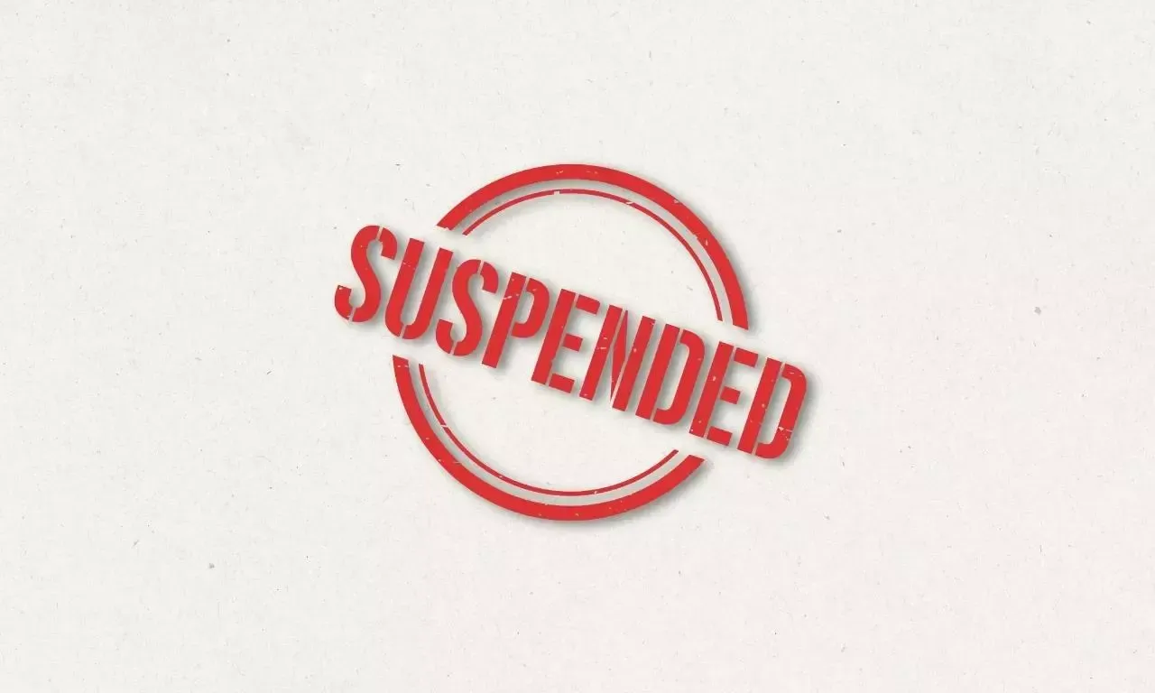 A red stamp that says suspended on a white background