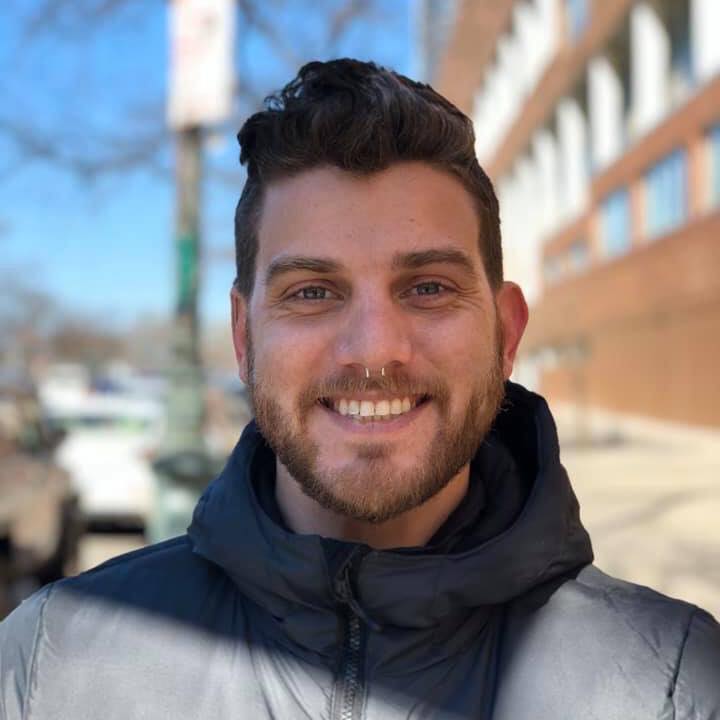 Daniel Hatcher, project coordinator for RecoveryATX and drag artist, smiles for a photo.