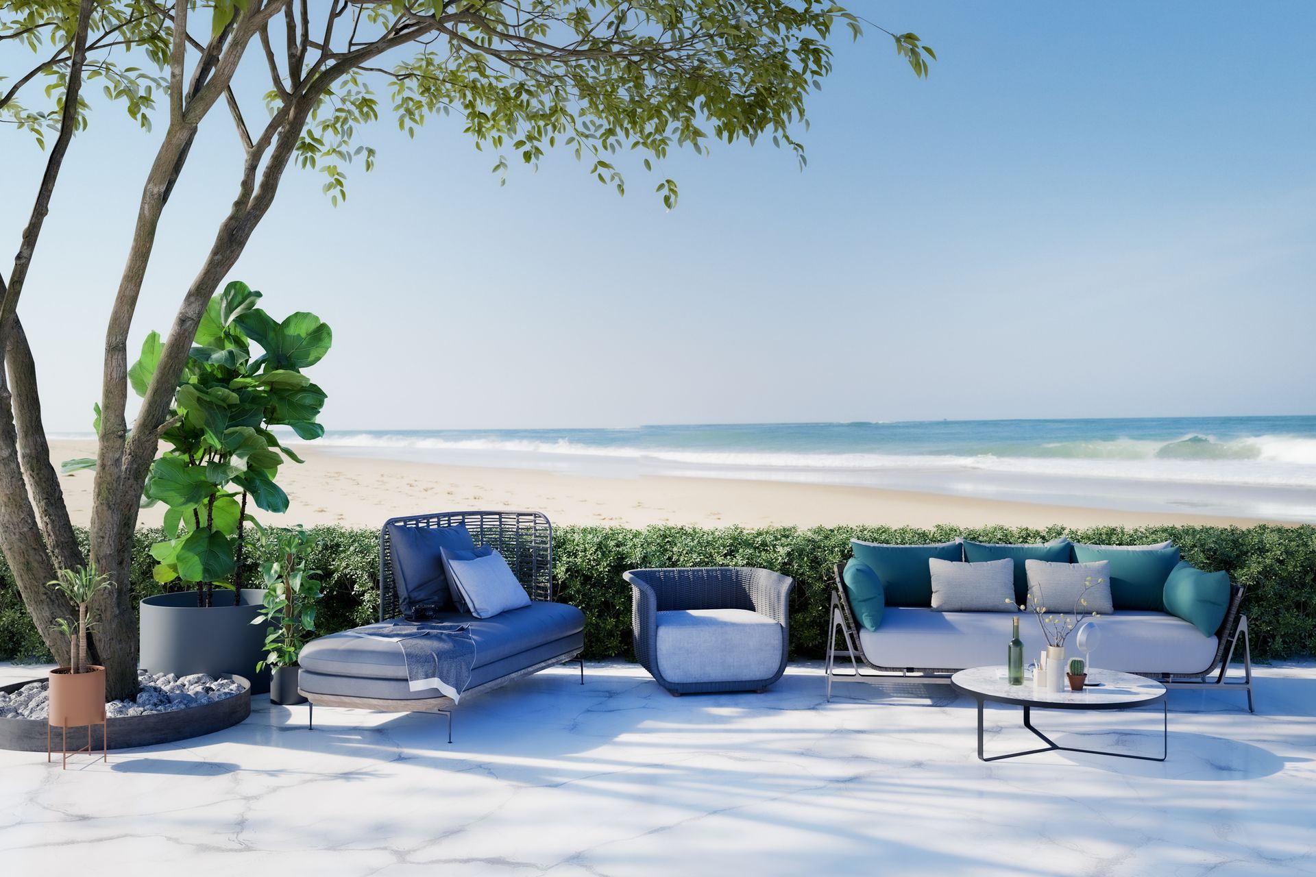 A patio with a couch , chair , and table with a view of the ocean.