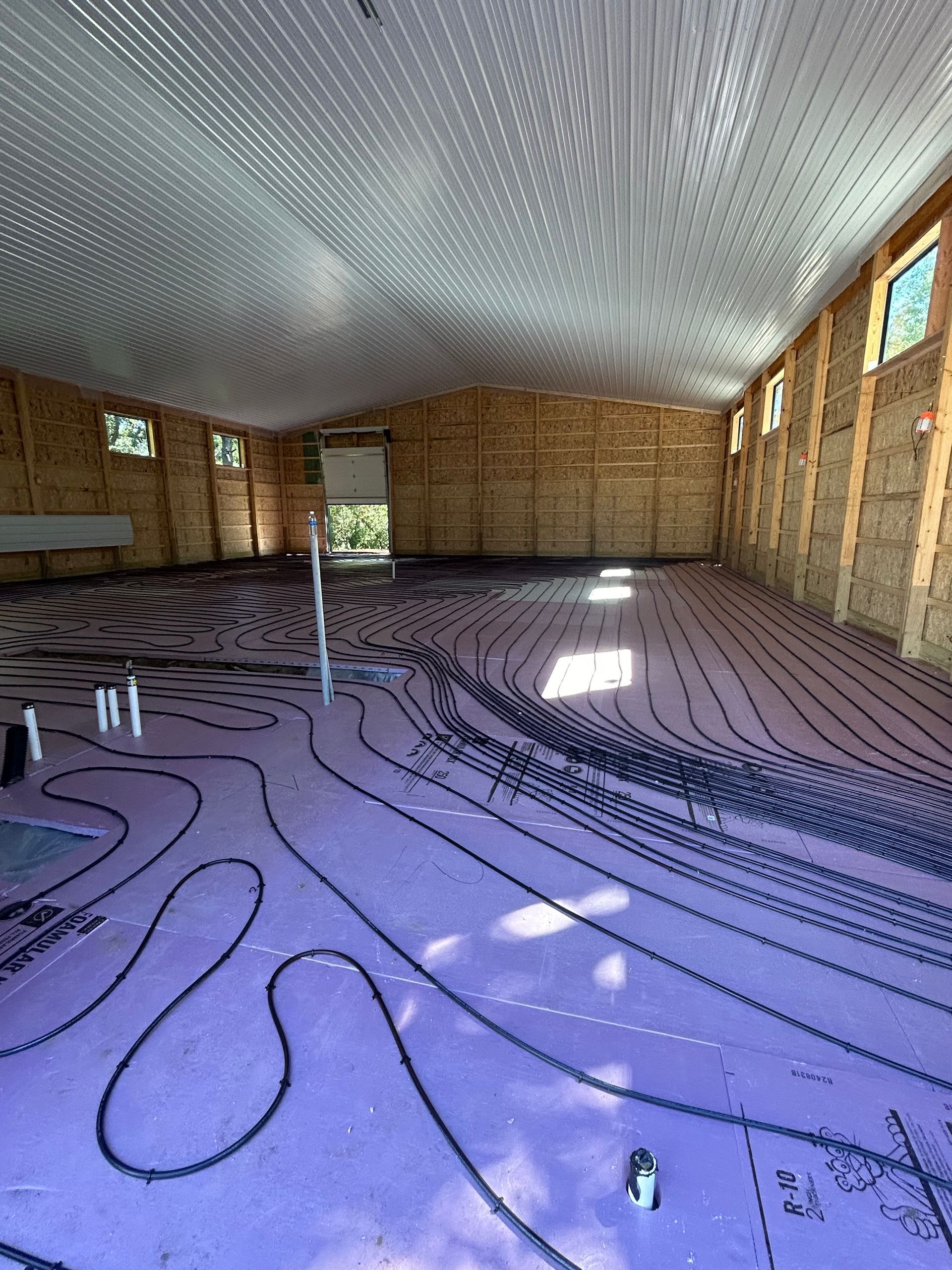 A large room with a lot of wires on the floor.