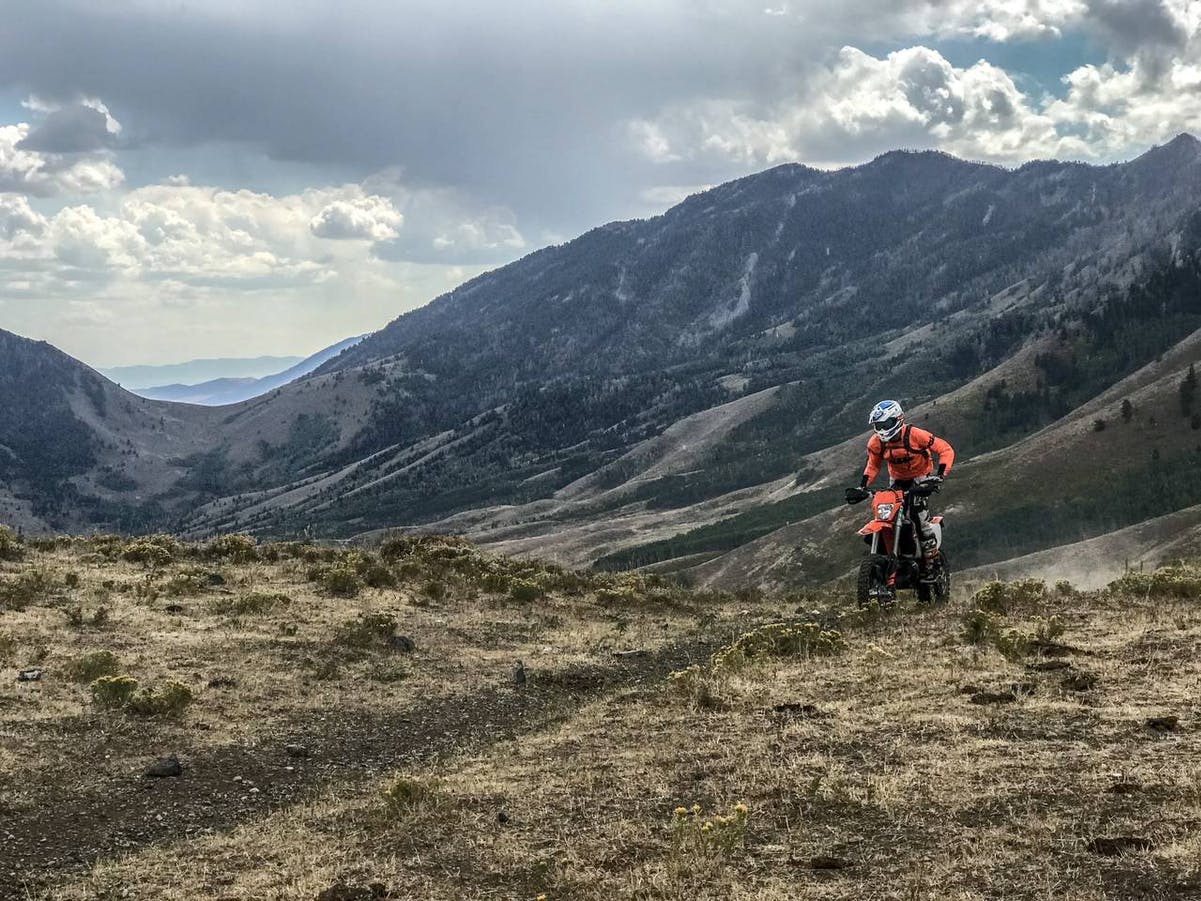 Motorcycle rider on an off-road single track in UT
