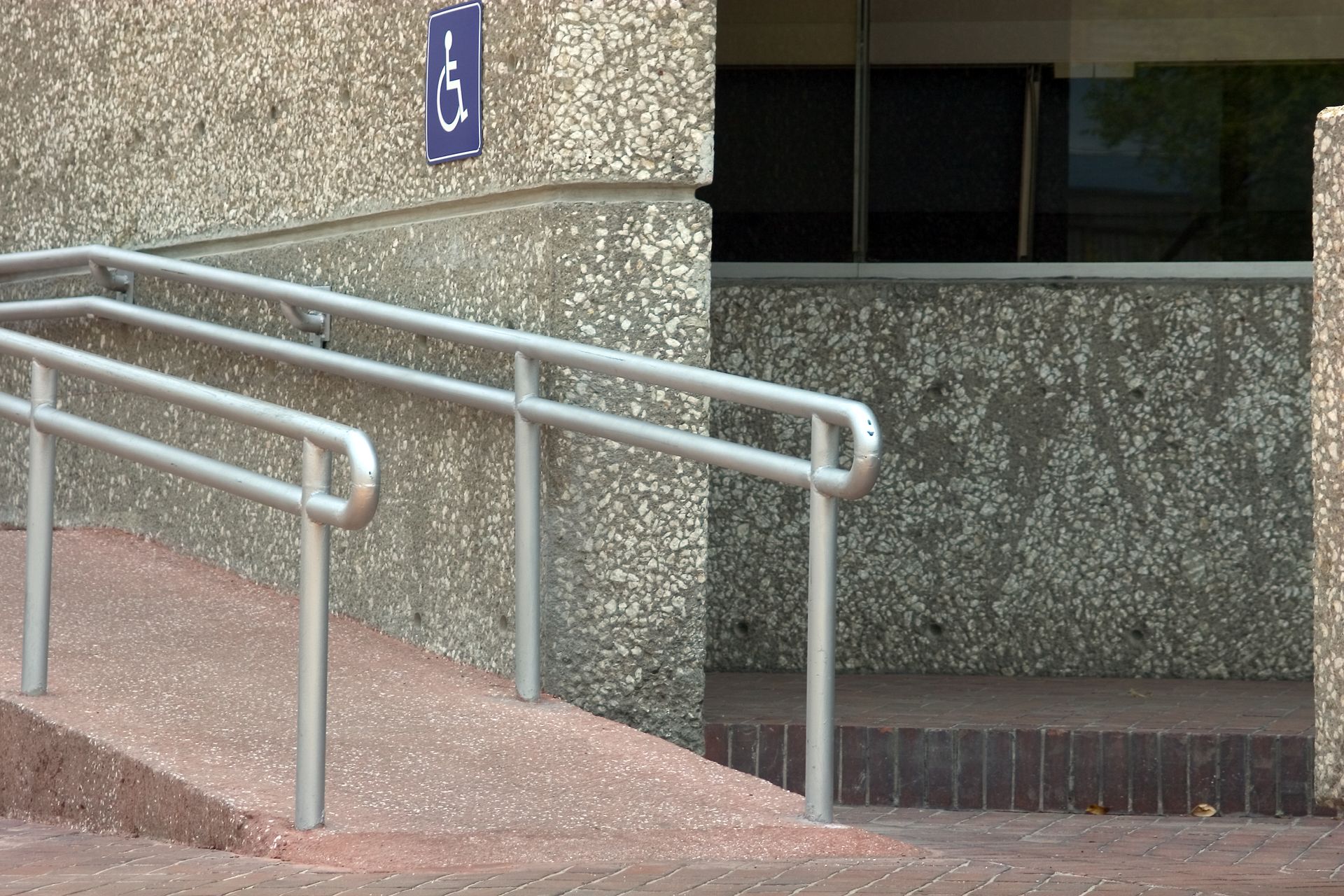 A ramp with a handicap sign above it