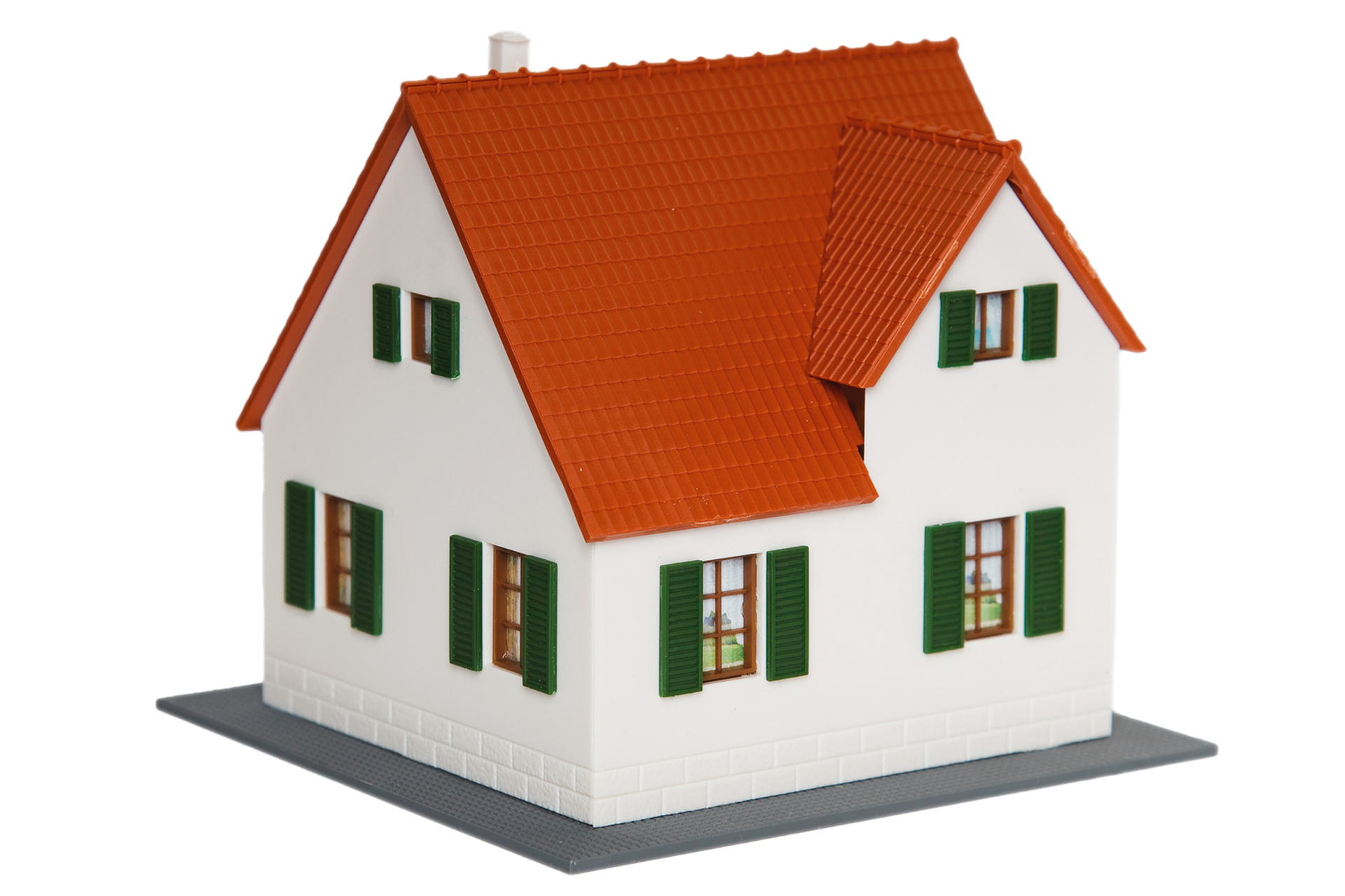 A model house with a red roof and green shutters