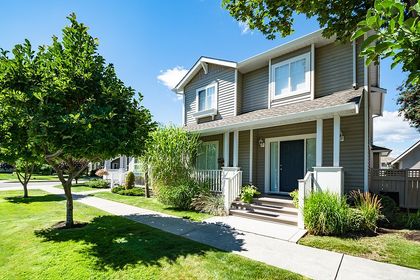 a concrete house with a front lawn