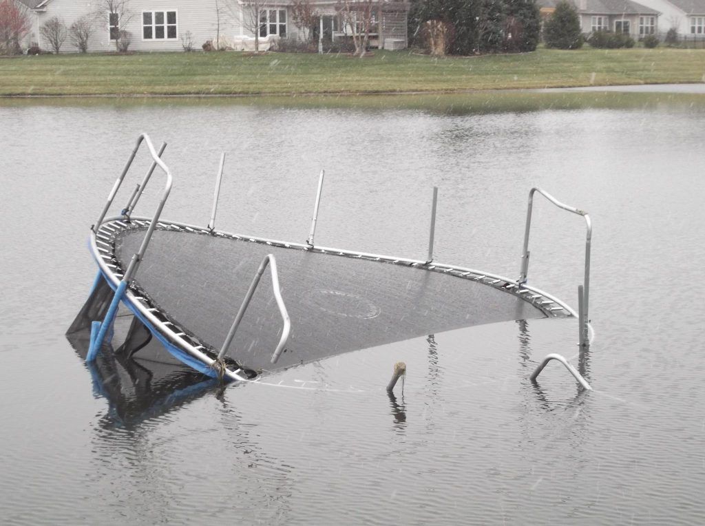 Trampoline In Pond — Indianapolis, IN — AC Trash Hauling & More