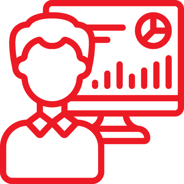 Person in front of a computer screen displaying graphs and charts.