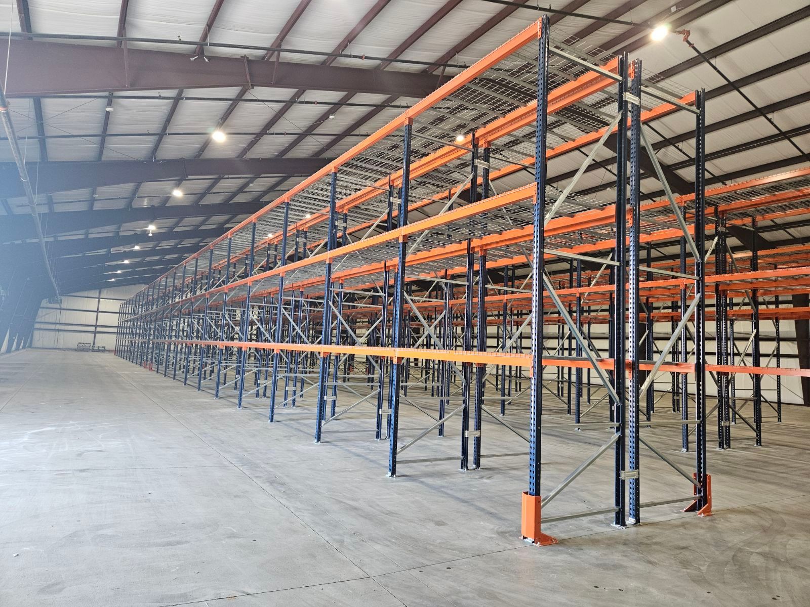 A large warehouse filled with lots of shelves and racks.