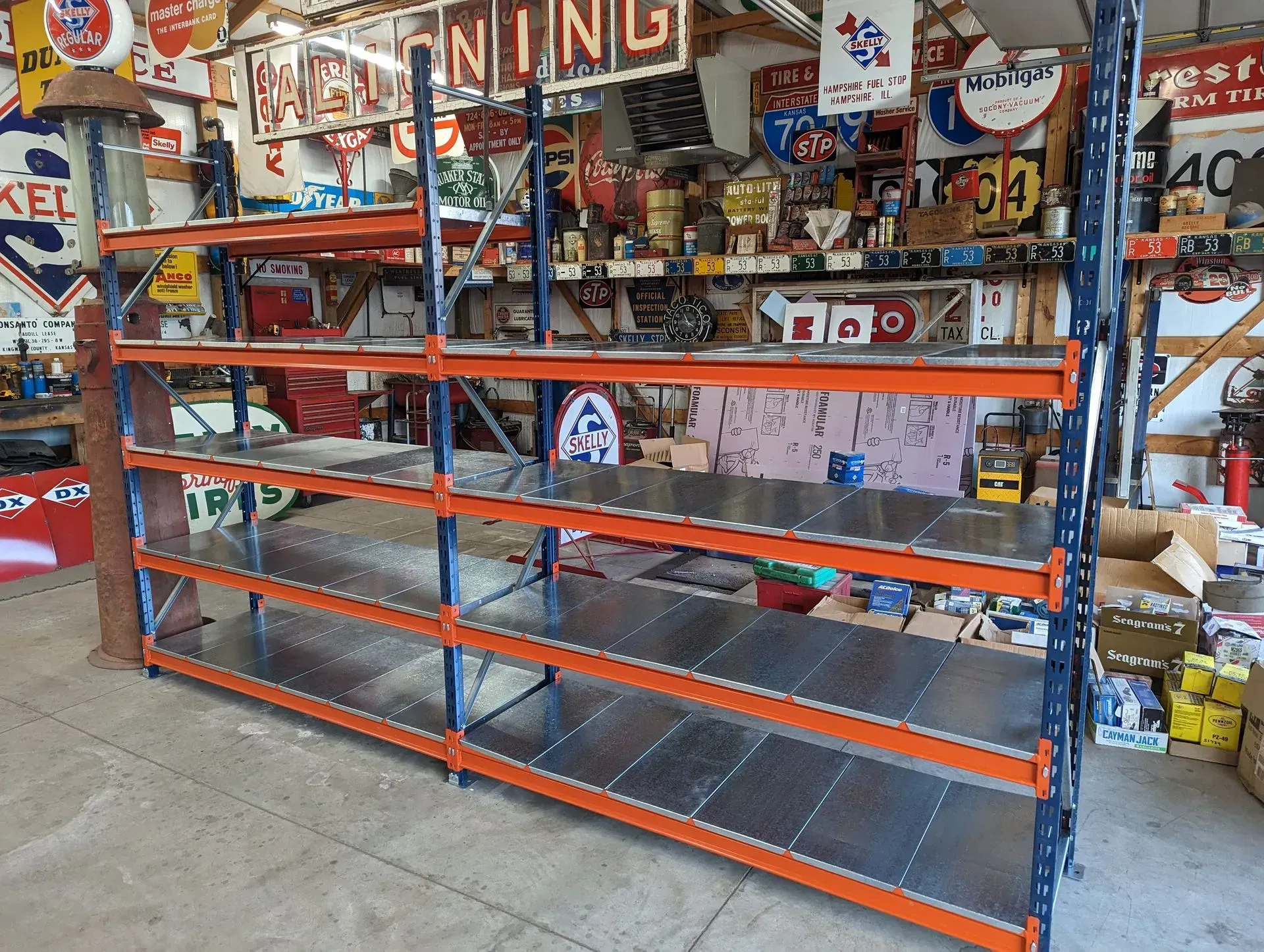 An empty warehouse with a sign that says ' loading ' on it