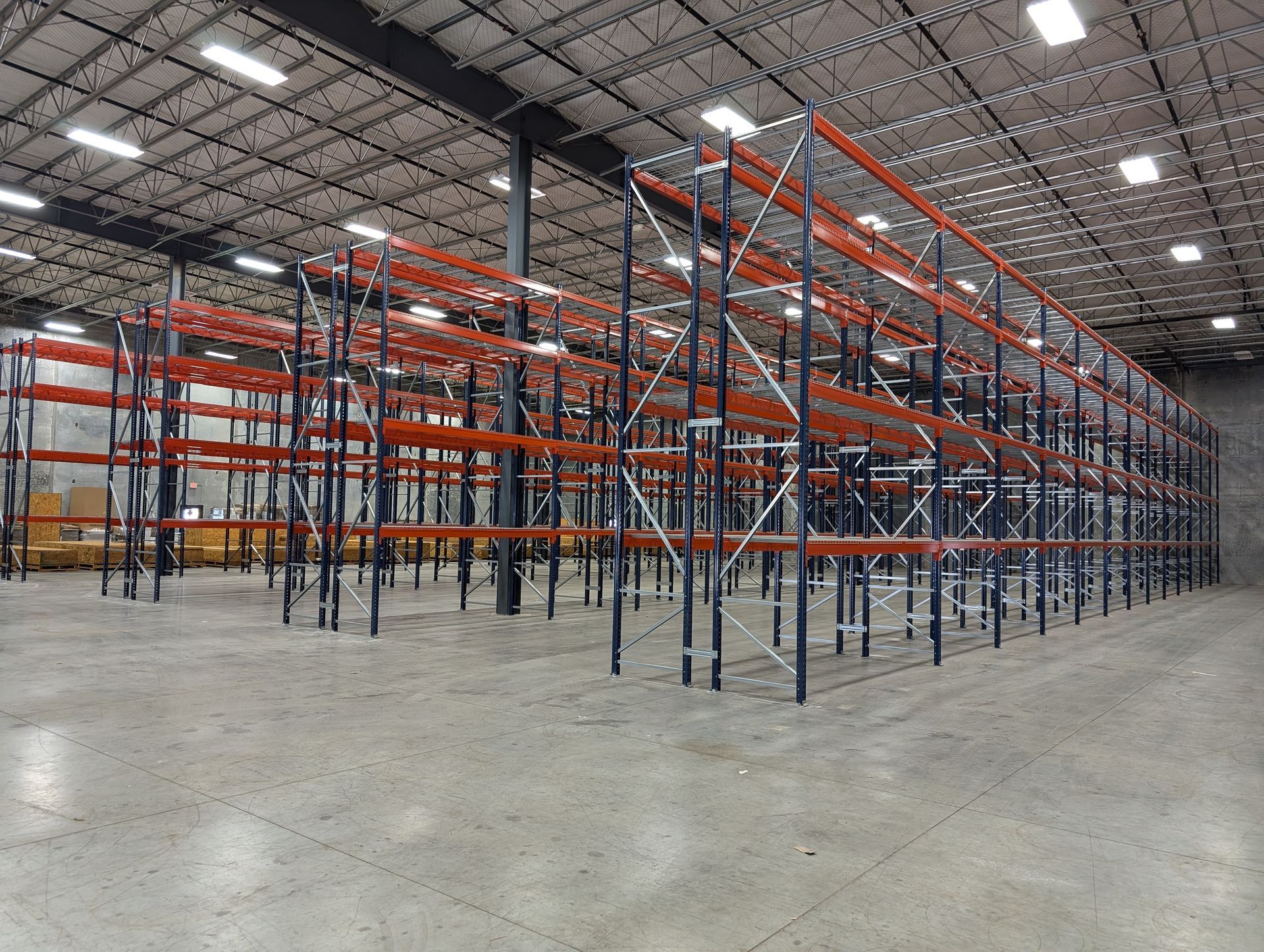 A large warehouse filled with lots of pallet racks.