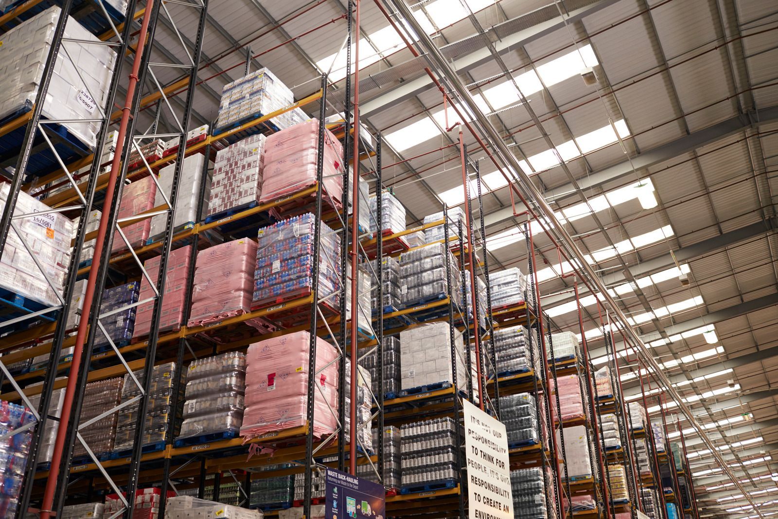 A large warehouse filled with lots of shelves and boxes.