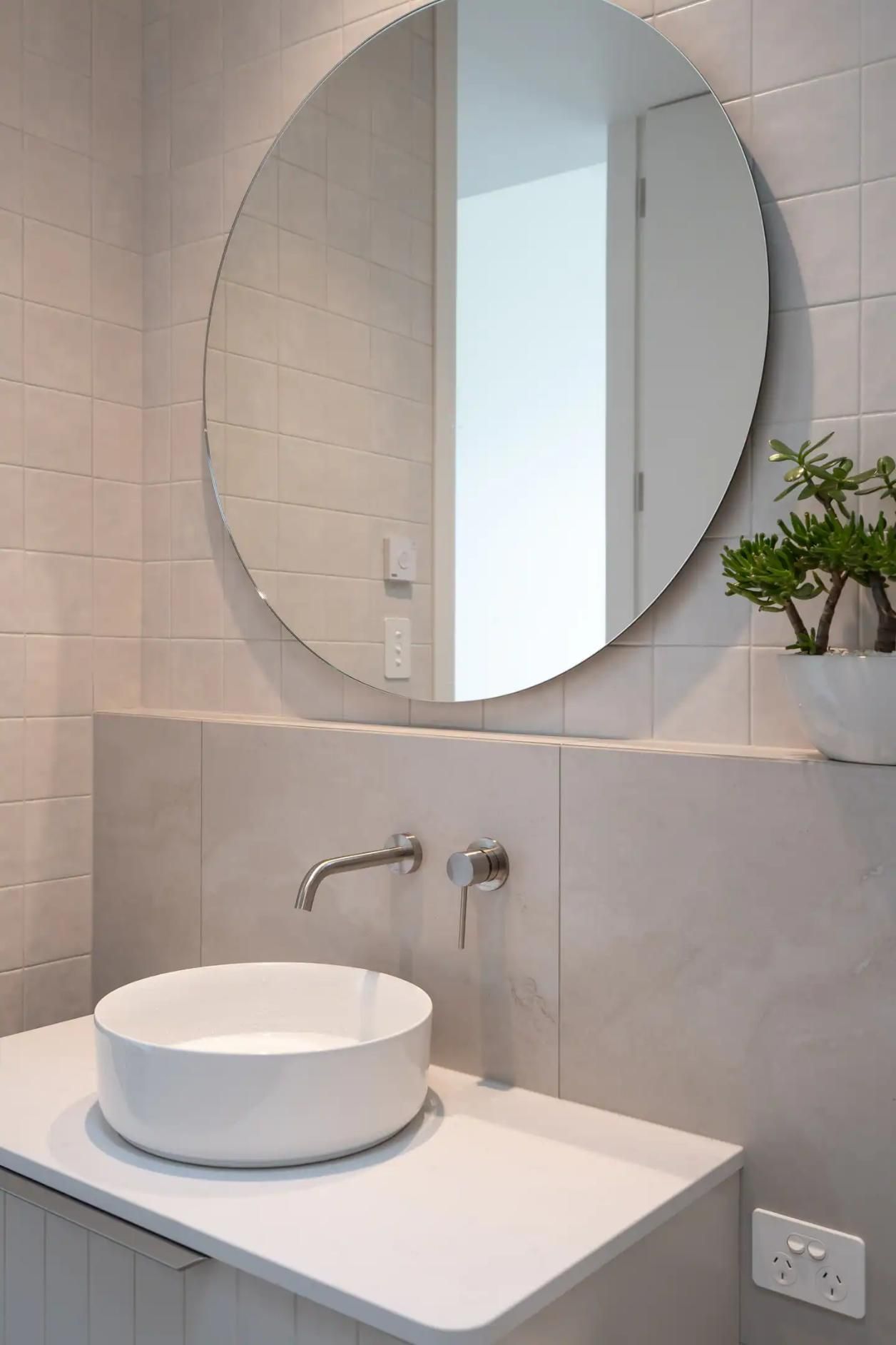 A Bathroom With A Sink and A Round Mirror  — That Painter Guy In South Nowra, NSW