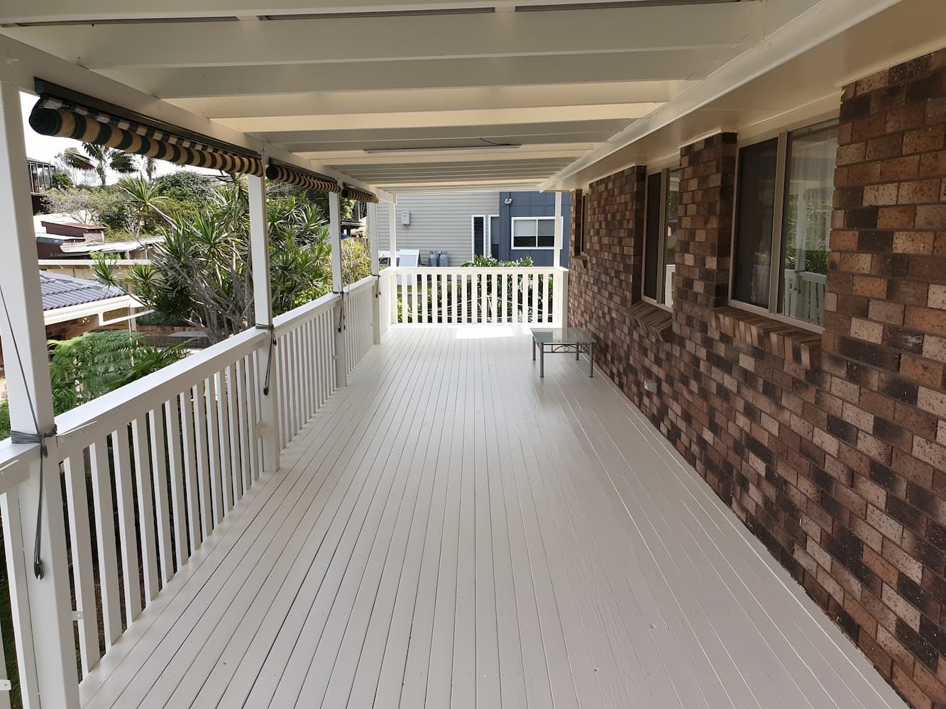 A white porch with a brick wall and a white railing — That Painter Guy In South Nowra, NSW