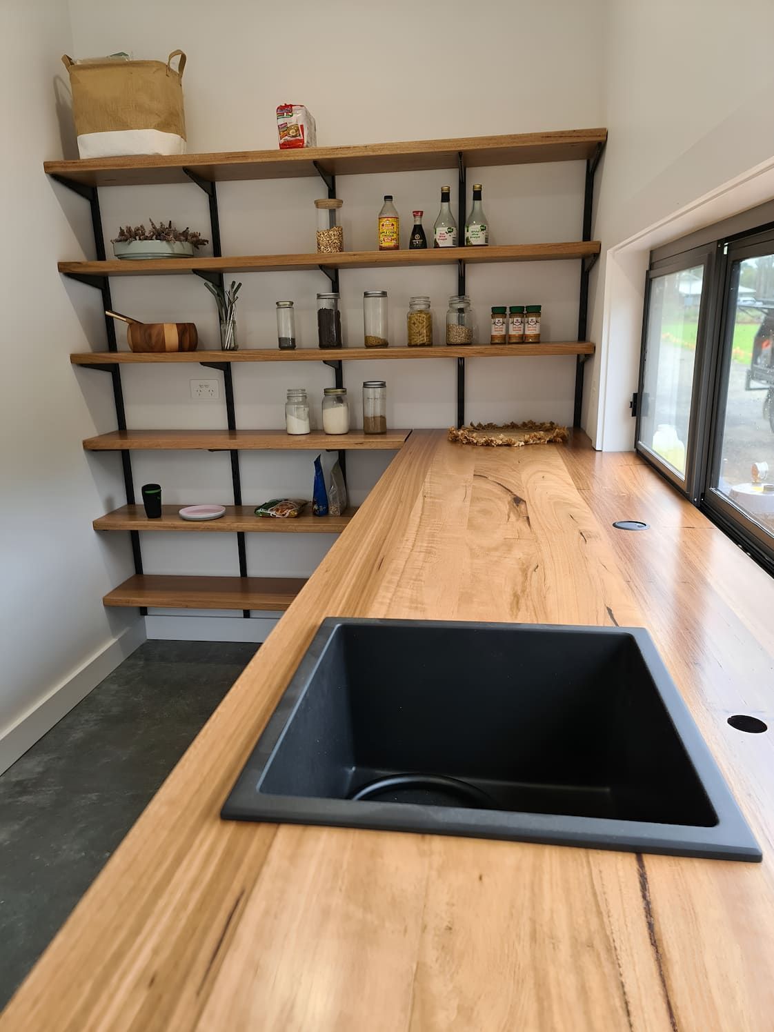 A Kitchen With A Wooden Counter Top And A Black Sink — That Painter Guy In South Nowra, NSW