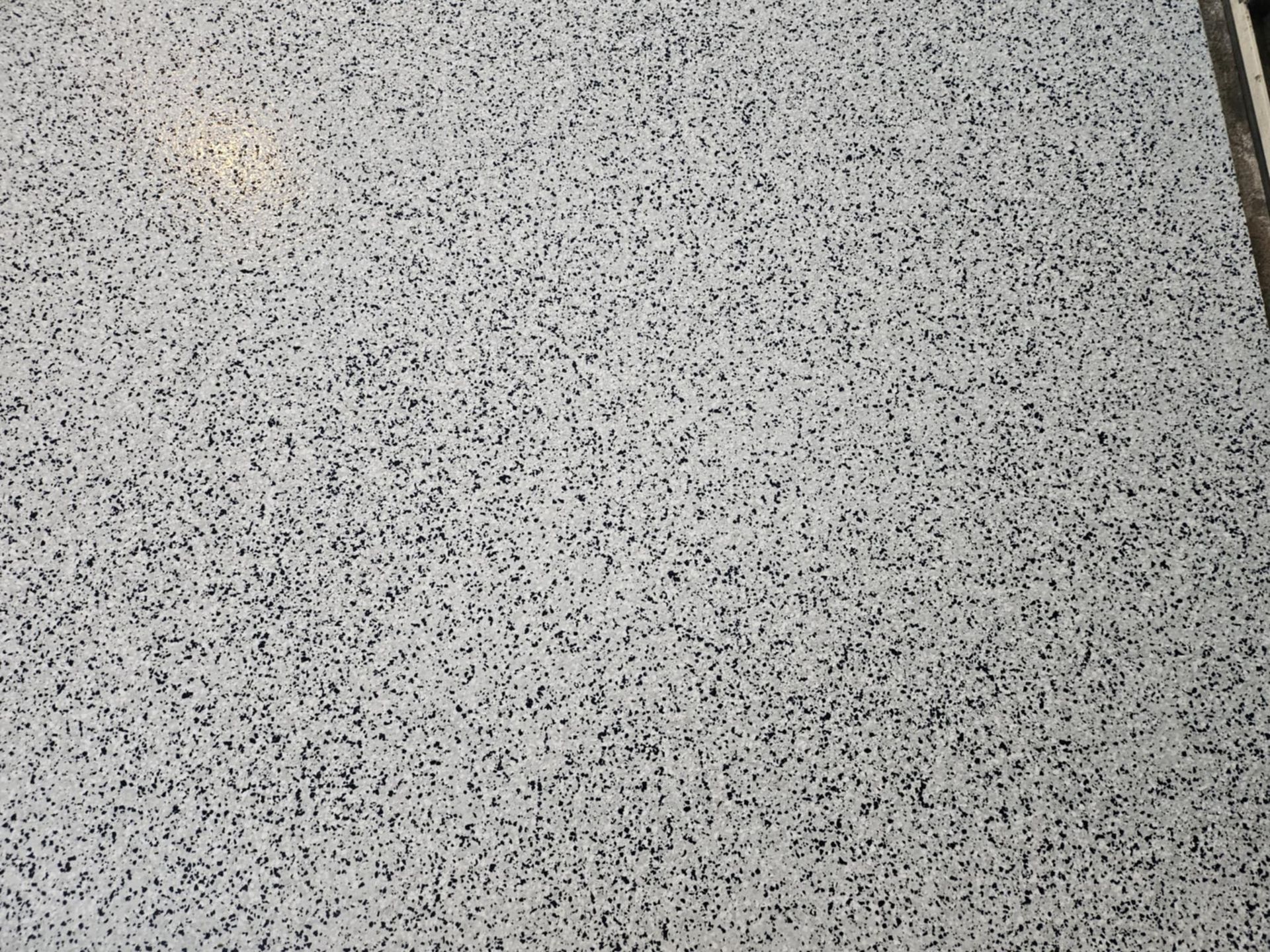 A close up of a white and black granite counter top.— That Painter Guy In South Nowra, NSW