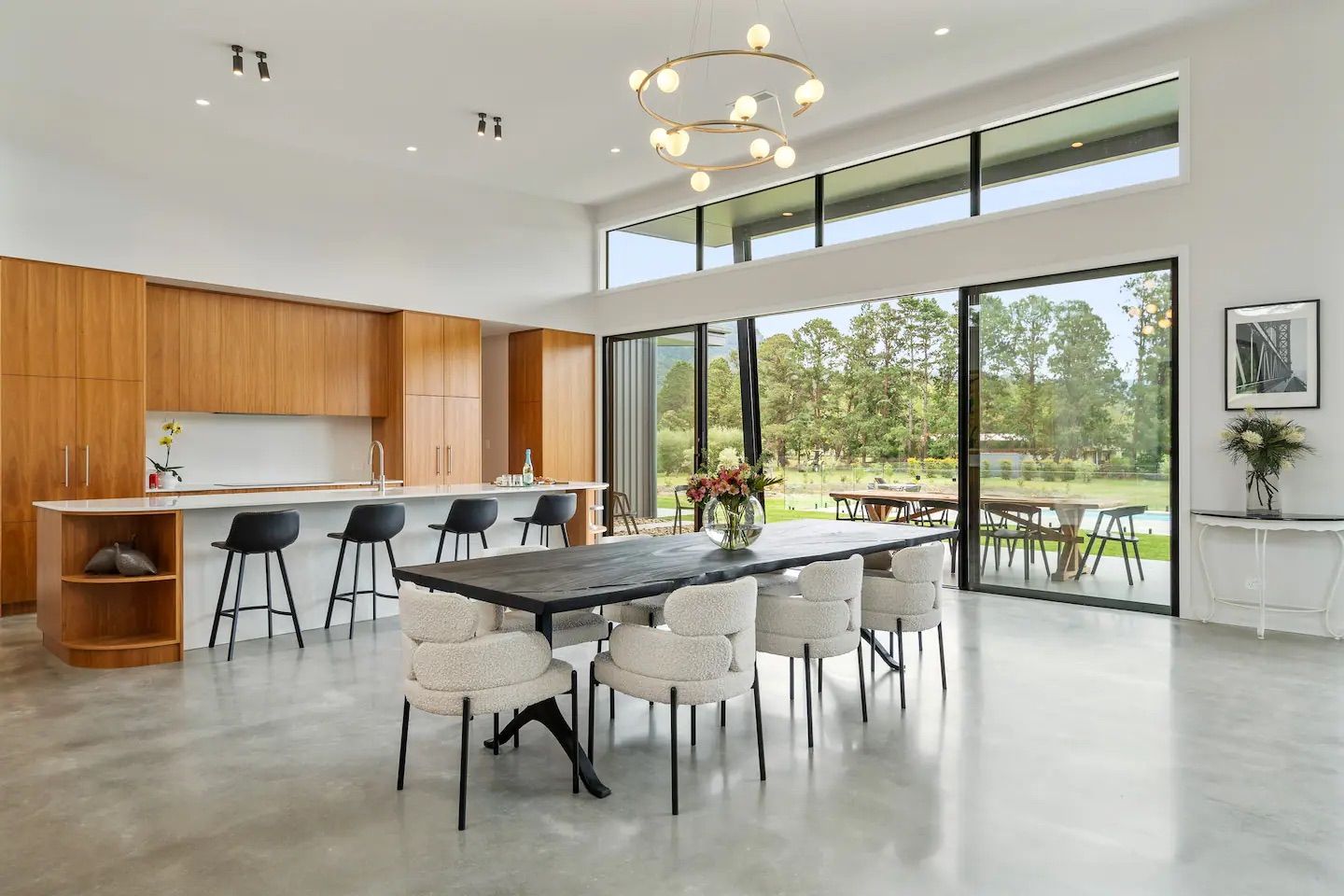 There is a dining table and chairs in the middle of the room. — That Painter Guy In South Nowra, NSW