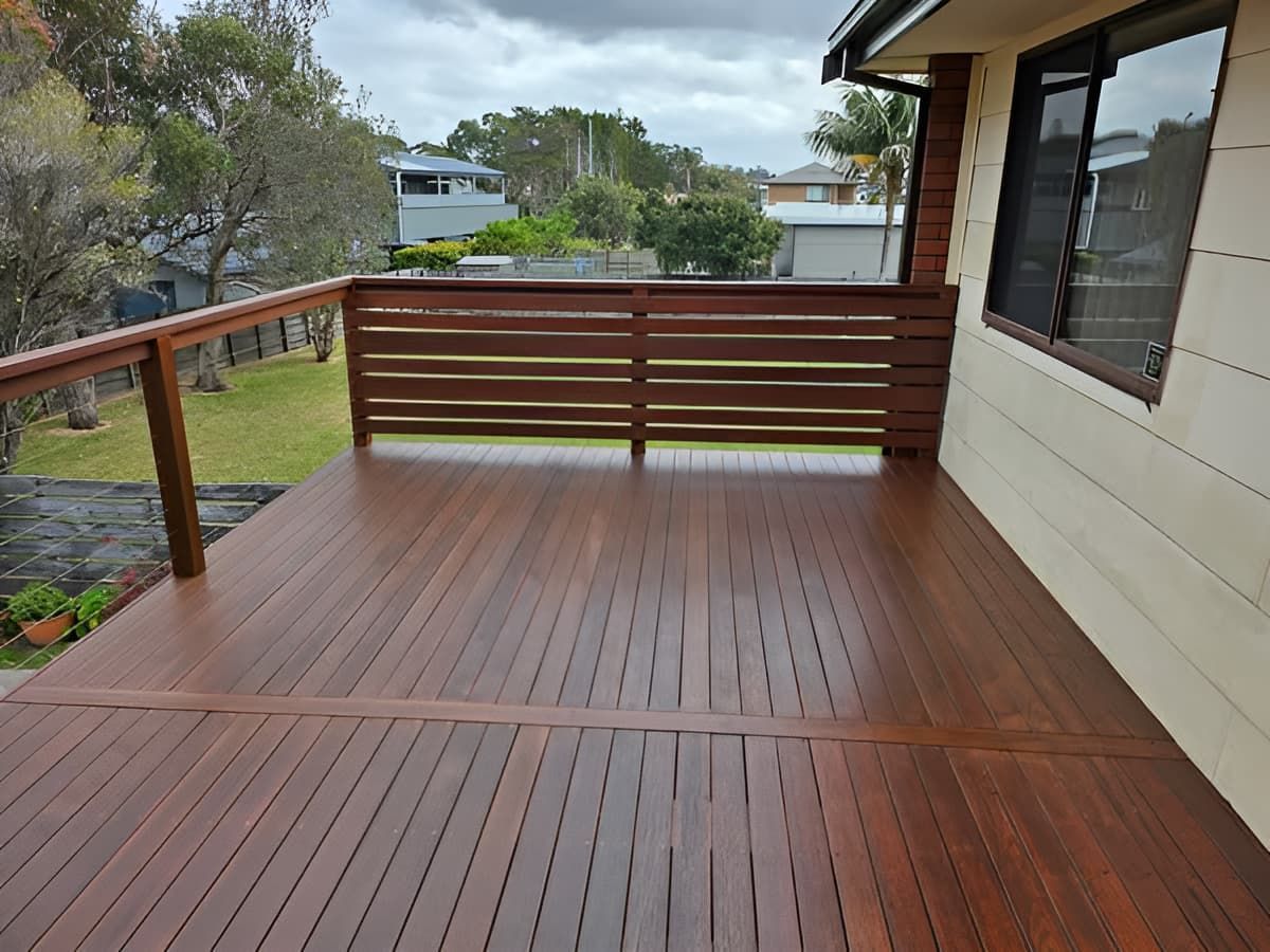 A Wooden Deck With A Railing On The Side Of A House — That Painter Guy In South Nowra, NSW