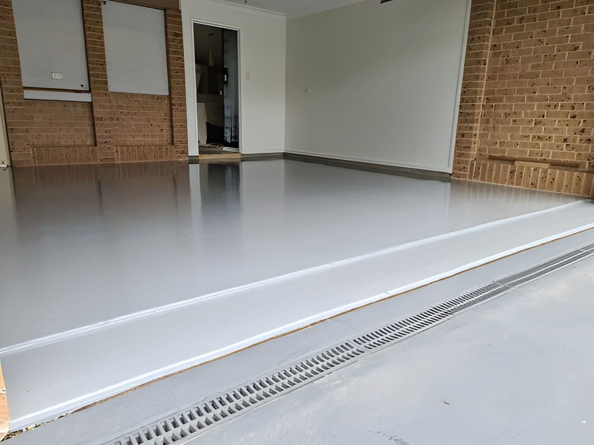 A Garage With A White Floor And A Brick Wall — That Painter Guy In South Nowra, NSW