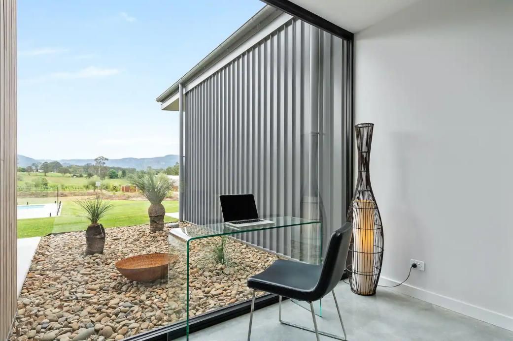 There Is A Desk With A Laptop On It In A Room With A Large Window  — That Painter Guy In South Nowra, NSW