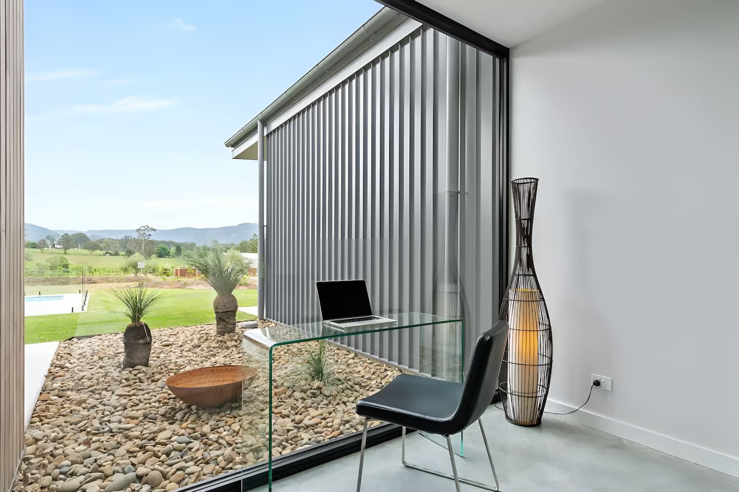 A Desk With A Laptop On It In A Room With A Large Window — That Painter Guy In South Nowra, NSW