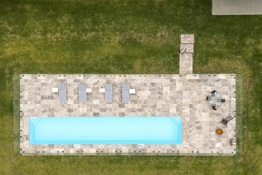 An Aerial View Of A Large Swimming Pool Surrounded By Grass  — That Painter Guy In South Nowra, NSW