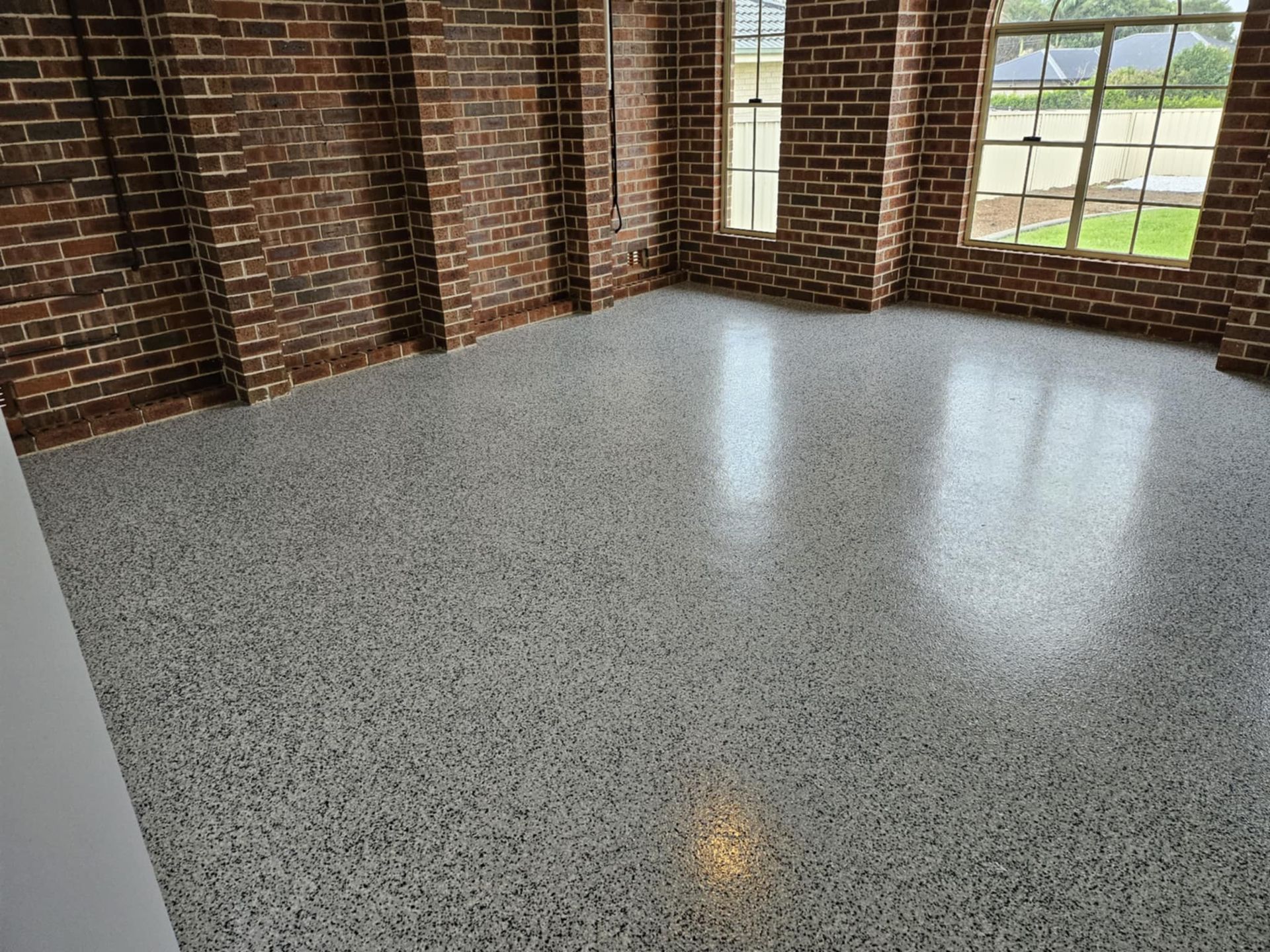 A room with brick walls and a white floor— That Painter Guy In South Nowra, NSW