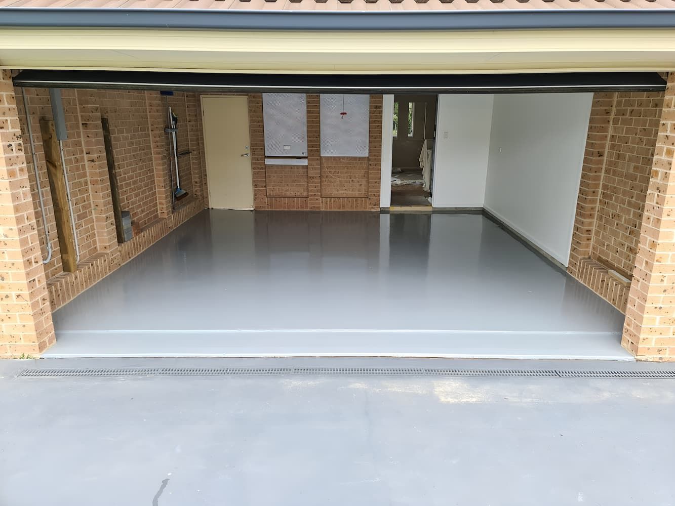 A Garage With A Concrete Floor And A Brick Wall — That Painter Guy In South Nowra, NSW