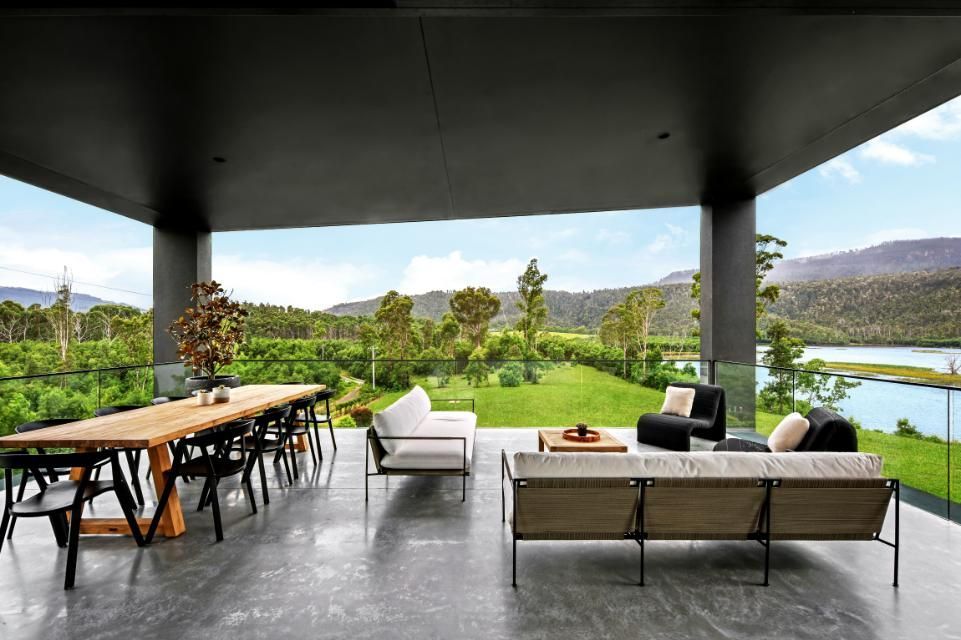 A Patio With A Table and Chairs and A View Of A Lake  — That Painter Guy In South Nowra, NSW