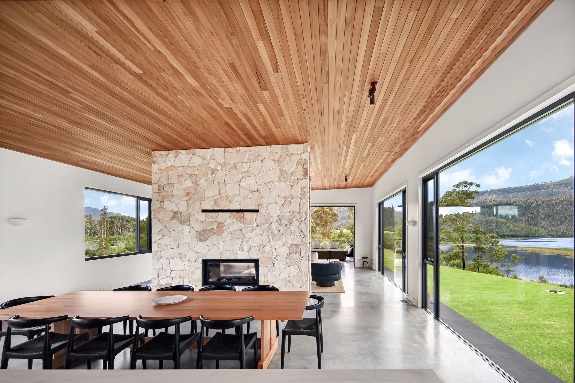 A dining room with a wooden table and chairs and a fireplace.— That Painter Guy In South Nowra, NSW