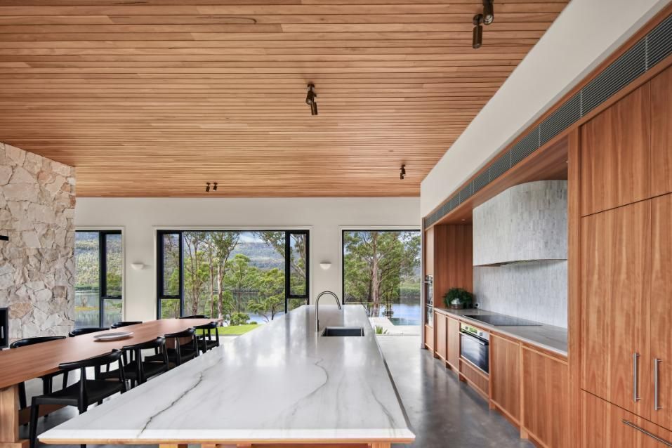 A Kitchen With A Marble Counter Top and Wooden Cabinets  — That Painter Guy In South Nowra, NSW
