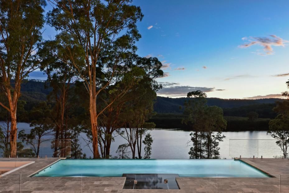A Large Swimming Pool With A View Of A Lake Surrounded By Trees — That Painter Guy In South Nowra, NSW