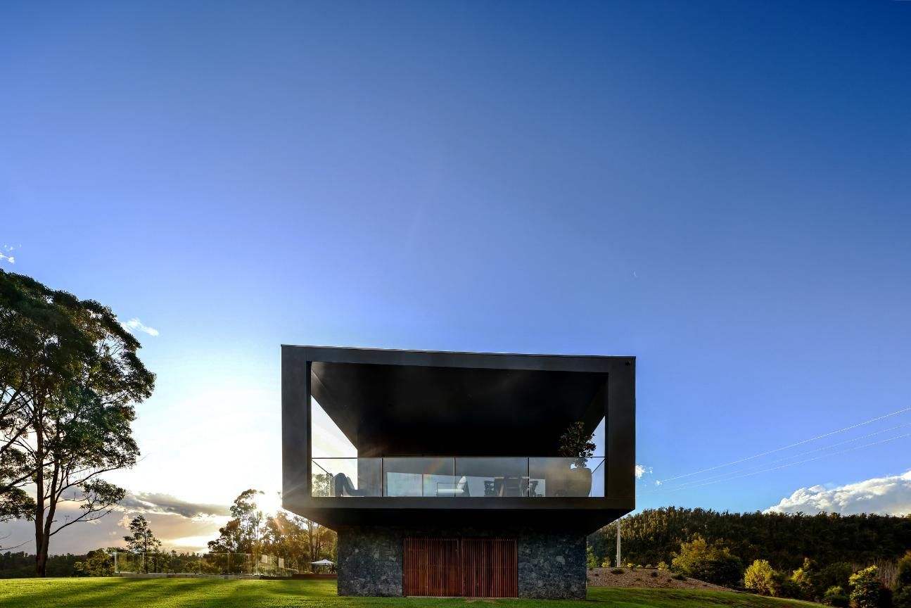 A Modern House Is Sitting On Top Of A Grassy Hill  — That Painter Guy In South Nowra, NSW