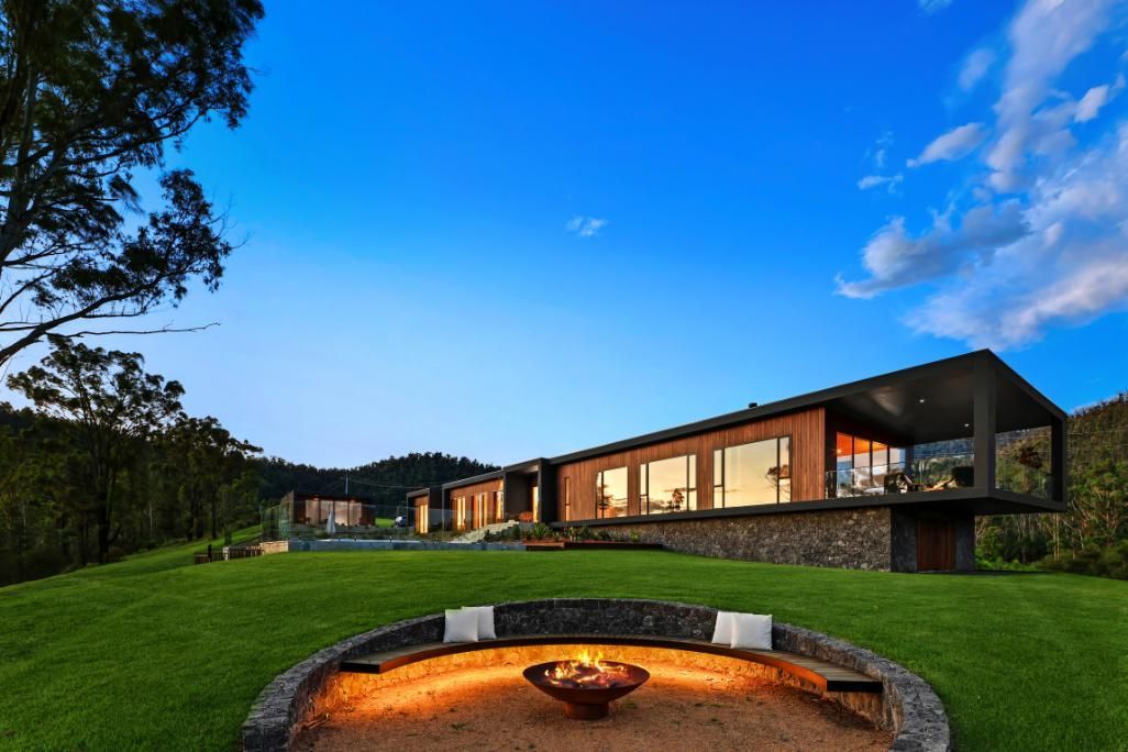 A Modern House With A Fire Pit In Front Of It  — That Painter Guy In South Nowra, NSW