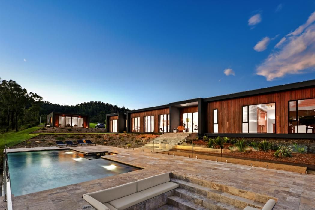 A Large House With A Swimming Pool and A Fire Pit In Front Of It — That Painter Guy In South Nowra, NSW