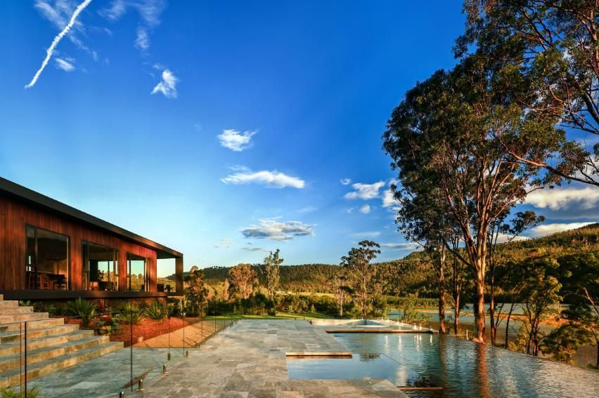 A House With A Swimming Pool In Front Of It and Trees In The Background  — That Painter Guy In South Nowra, NSW