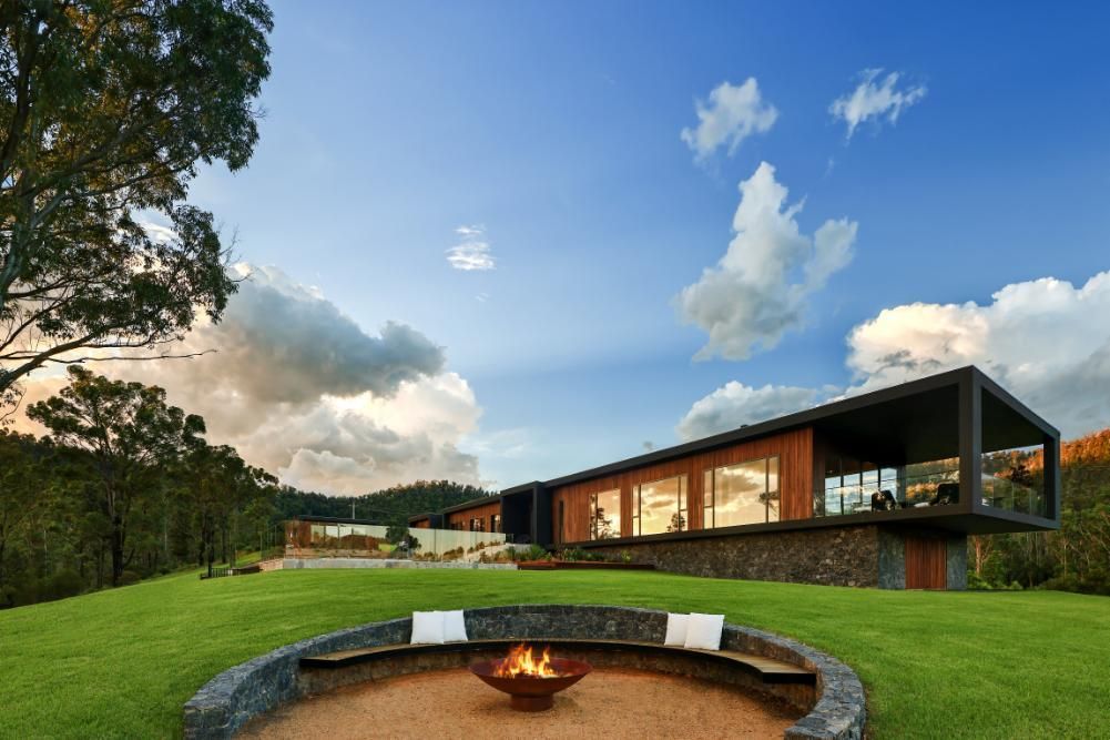 There Is A Fire Pit In The Middle Of The Grass In Front Of A House  — That Painter Guy In South Nowra, NSW