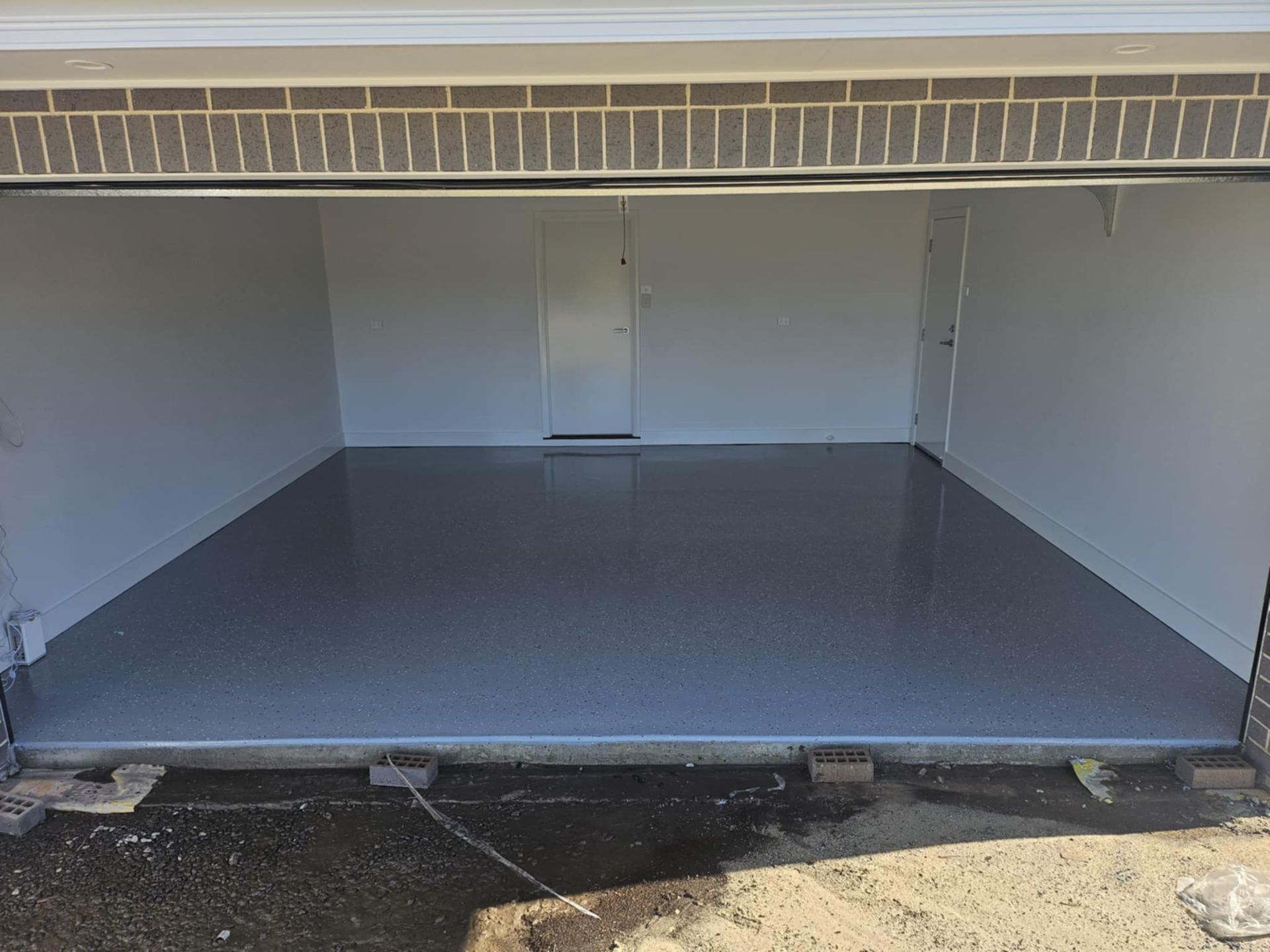 A garage with a gray floor and white walls.— That Painter Guy In South Nowra, NSW