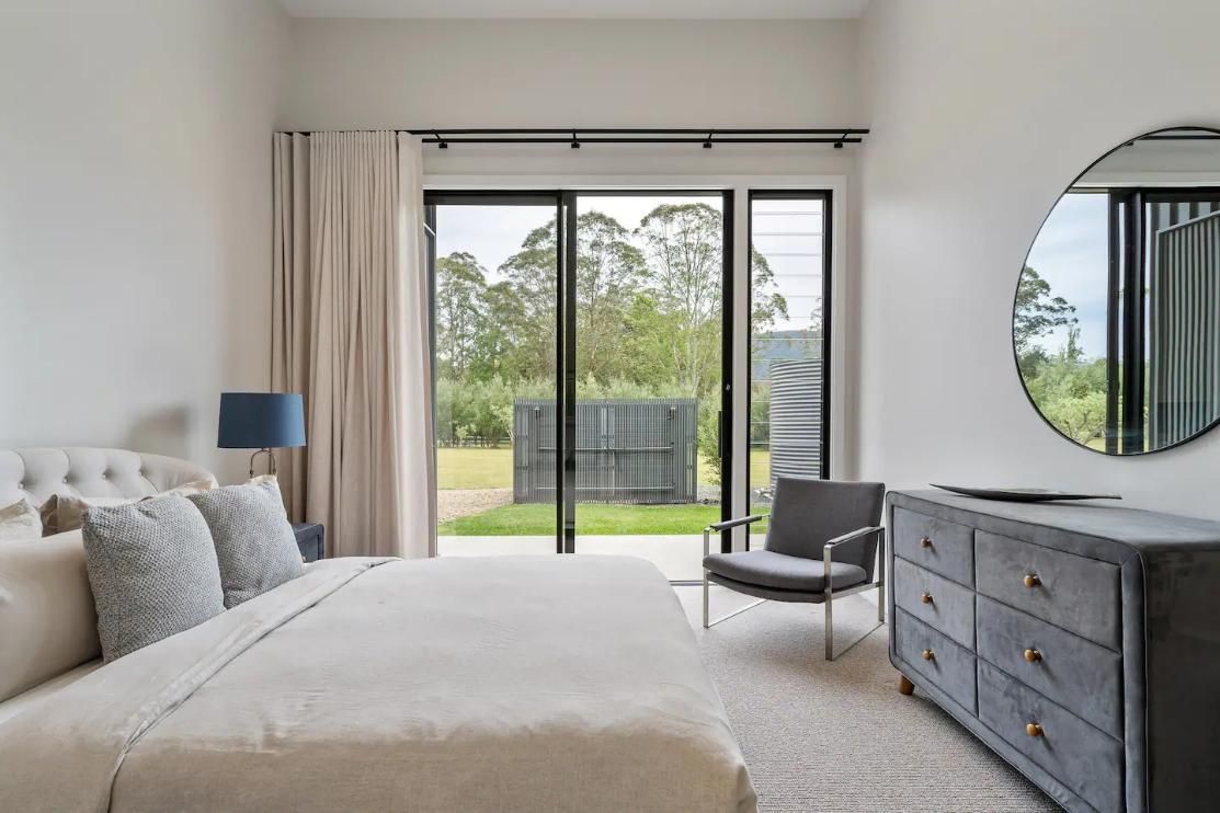 A Bedroom With A Large Bed , Dresser , Chair and Mirror  — That Painter Guy In South Nowra, NSW