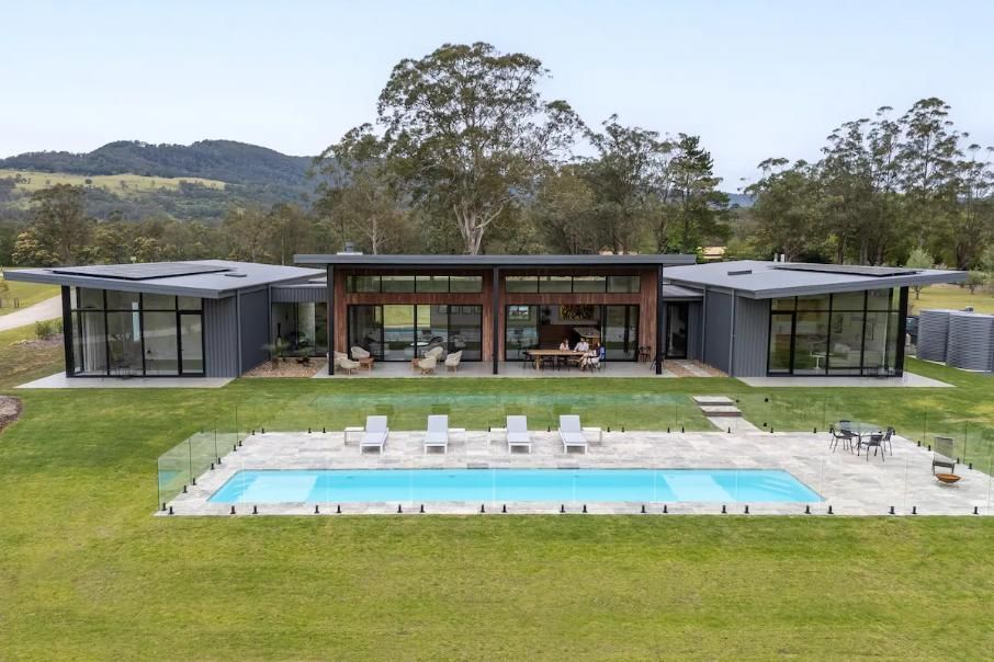 A Large House With A Large Swimming Pool In Front Of It  — That Painter Guy In South Nowra, NSW