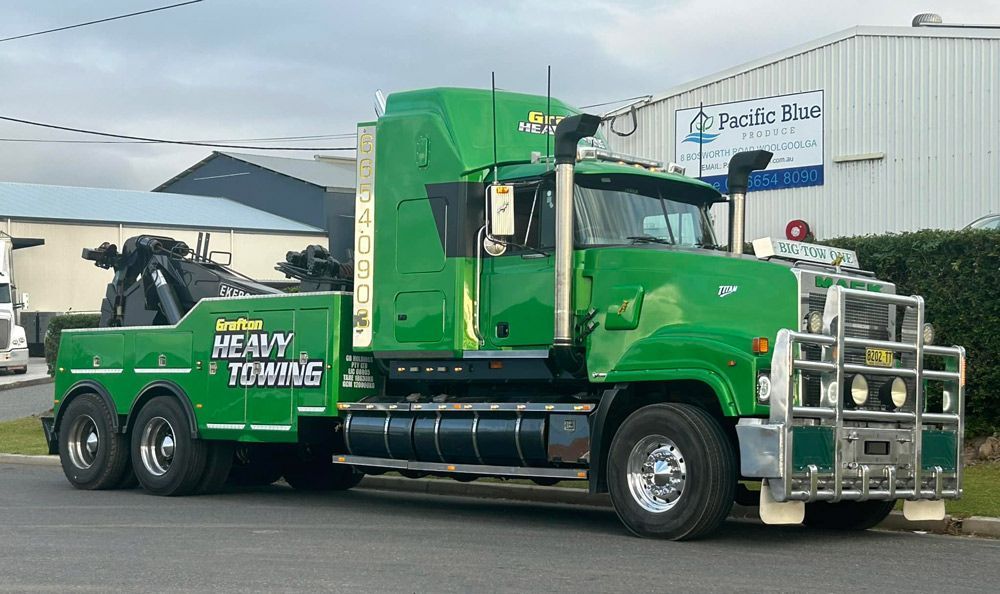 A Huge Green Towing Truck With Grafton Heavy Towing Branding on it — Grafton Heavy Towing In Grafton NSW