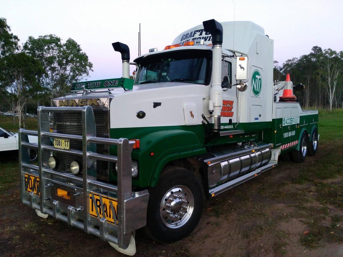 White and Green Towing Truck With Huge Bumpers — Grafton Heavy Towing In Grafton NSW
